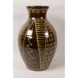 A large slipware decorated earthenware vase, 13" high