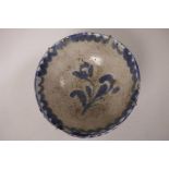 An early ceramic bowl with spongeware decoration in blue on a grey ground, 7" diameter