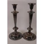 A pair of tall silver plated candlesticks, one sconce missing, 12½" high