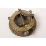 A replica brass sundial compass marked JH Steward Ltd London, 4" diameter, in a brass bound hardwood