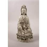 A Chinese blanc de chine Quan Yin seated on a lotus throne, impressed marks verso, 10" high