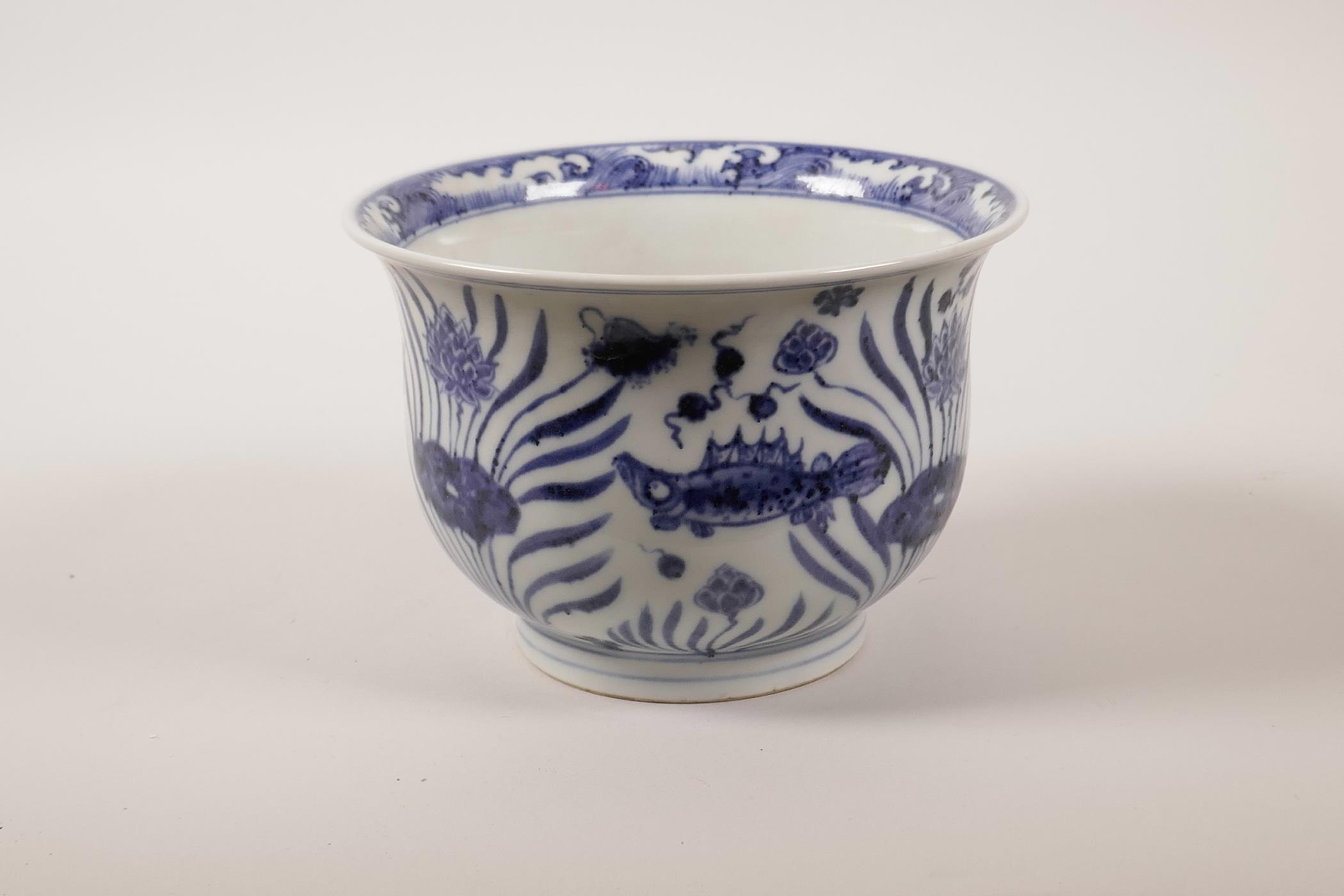 A Chinese blue and white porcelain steep sided bowl decorated with carp in a lotus pond, 4" high x - Image 5 of 7