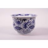 A Chinese blue and white porcelain steep sided bowl decorated with carp in a lotus pond, 4" high x