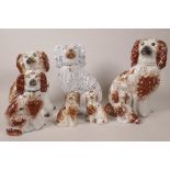 Seven Staffordshire flat back spaniels, largest 9½" high