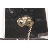 A gold (not marked) tie pin with the initials GS set with a diamond (3 grams)