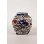 A small Chinese wucai porcelain vase with dragon decoration, 6 character mark to base, 4½" high