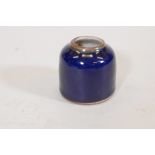 A Chinese blue glazed ceramic ink pot, double circle mark to base, 2½" high