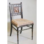 A C19th aesthetic ebonised and parcel gilt side chair with inset aboyna veneer panels, the back with