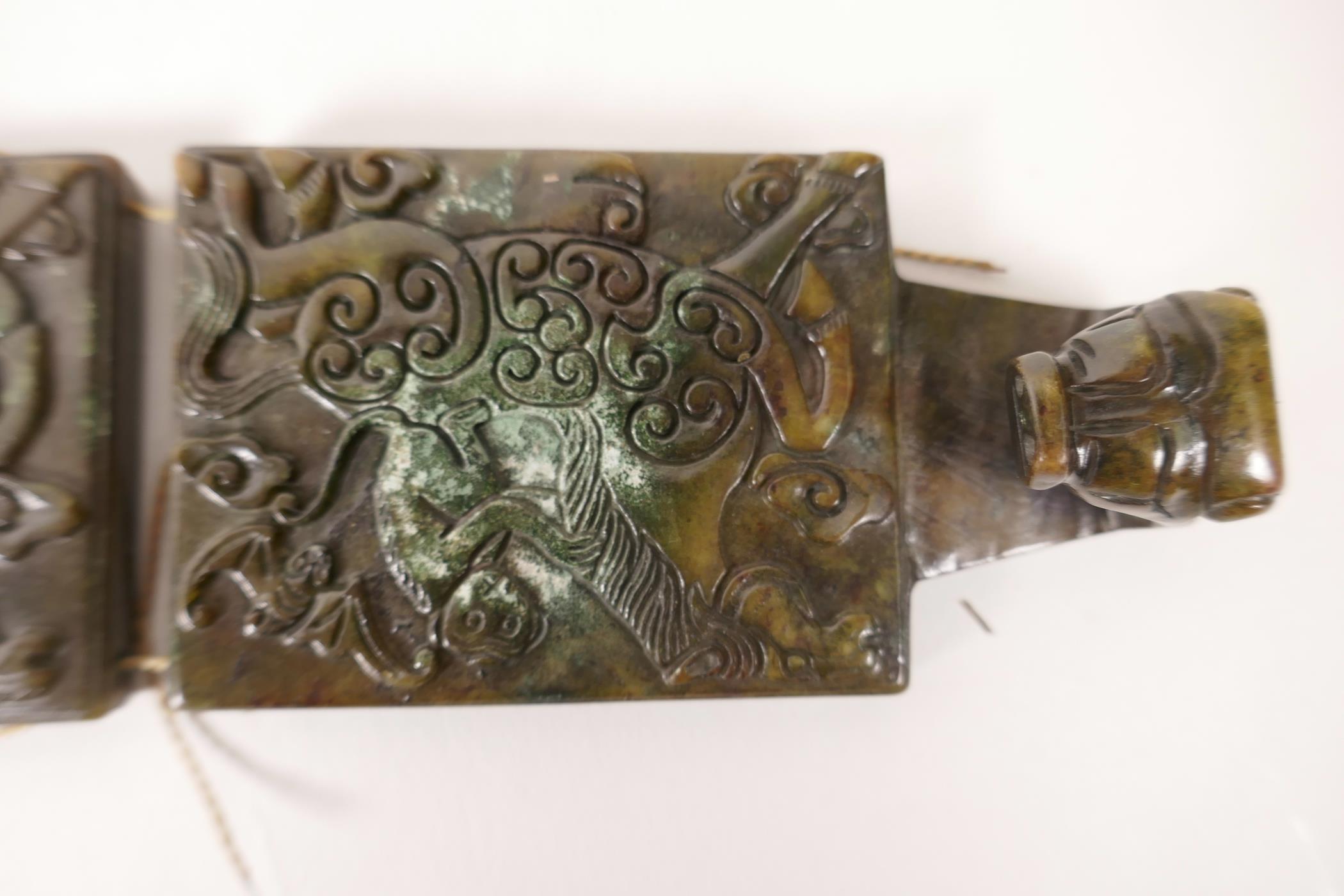 A Chinese mottled hardstone belt with carved decoration of a monkey riding a horse, 39" long - Image 2 of 2