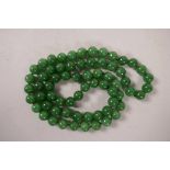 A string of jade beads, 30" long