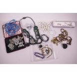 A quantity of costume jewellery to include necklaces, brooches, earrings etc