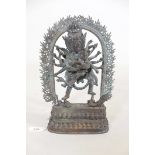 An Oriental bronze figure of Shiva, 12" high