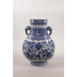 A Chinese blue and white porcelain vase with two elephant head handles and scrolling floral