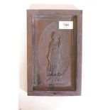 A wood panel with raised Buddha decoration, 6" x 9¼"