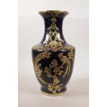 A Chinese blue ground porcelain vase with gilt metal bound decoration depicting exotic birds, seal
