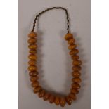 A chunky faux amber beaded necklace, 24" long