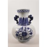 A Chinese blue and white pottery two handled vase with floral decoration, 4 character mark to