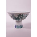 A Chinese blue and white porcelain stem bowl with green enamelled dragon decoration, 6 character
