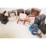 A quantity of vintage valve and transistor radios, a Kodascope model A projector, a Bell and