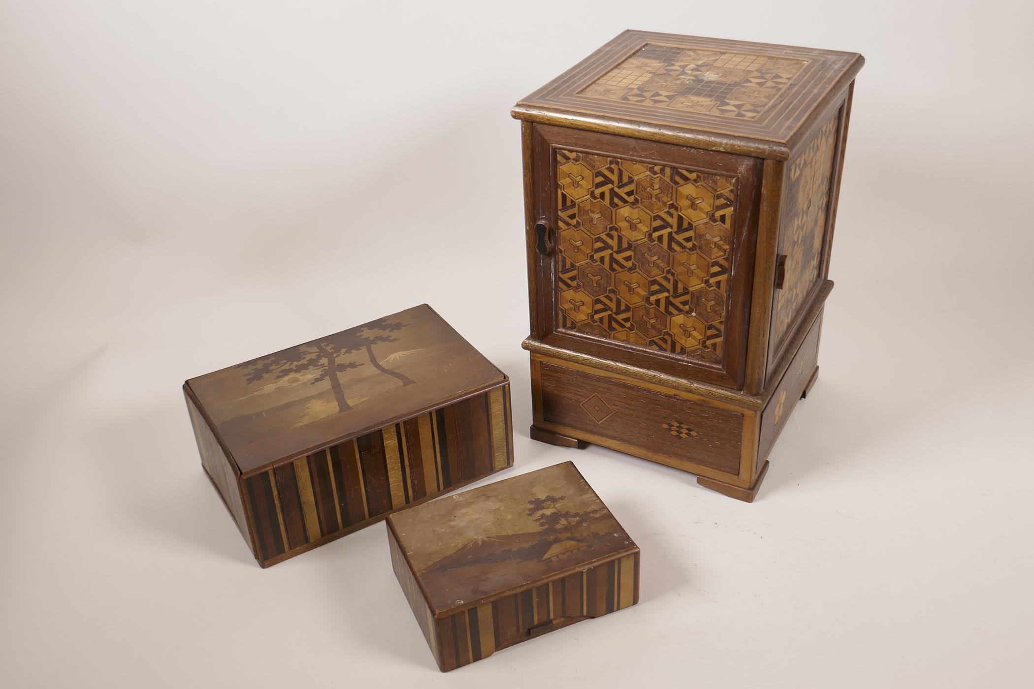 A Japanese Meiji period marquetry inlaid cigarette/cigar box, 9¾" high x 6½" square, and two