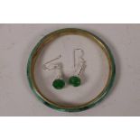 A Chinese jade bangle and a pair of jade and silver drop earrings