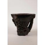 A Chinese faux horn libation cup with carved dragon decoration, impressed seal mark to base, 5" high