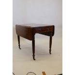 A George III mahogany Gillows style pembroke table, with single end drawer, raised on turned and