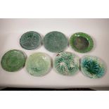 Seven C19th green leaf majolica plates, largest 9" diameter