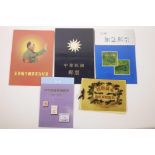 A quantity of assorted Chinese facsimile (replica) wallets of commemorative stamps, largest 16" x 7"
