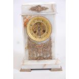 An onyx and ormolu mounted mantel clock, the brass dial with Arabic numerals and open escapement,