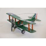 A tin model of a WW1 biplane, 11" long