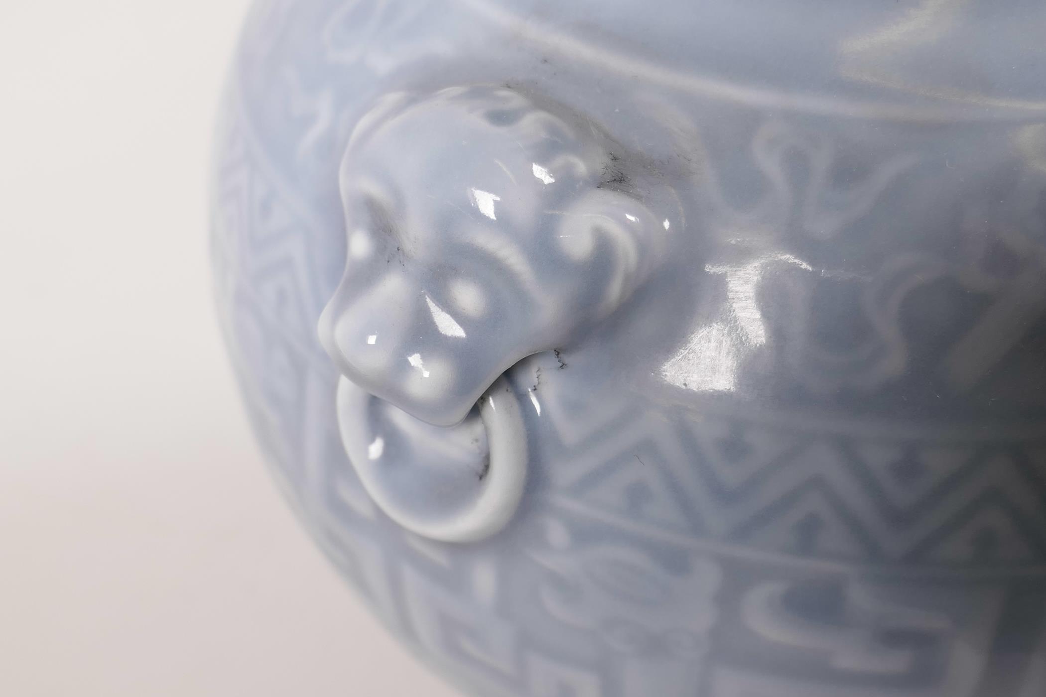 A Chinese powder blue glazed vase with two mask handles and archaic style decoration, seal mark to - Image 2 of 3