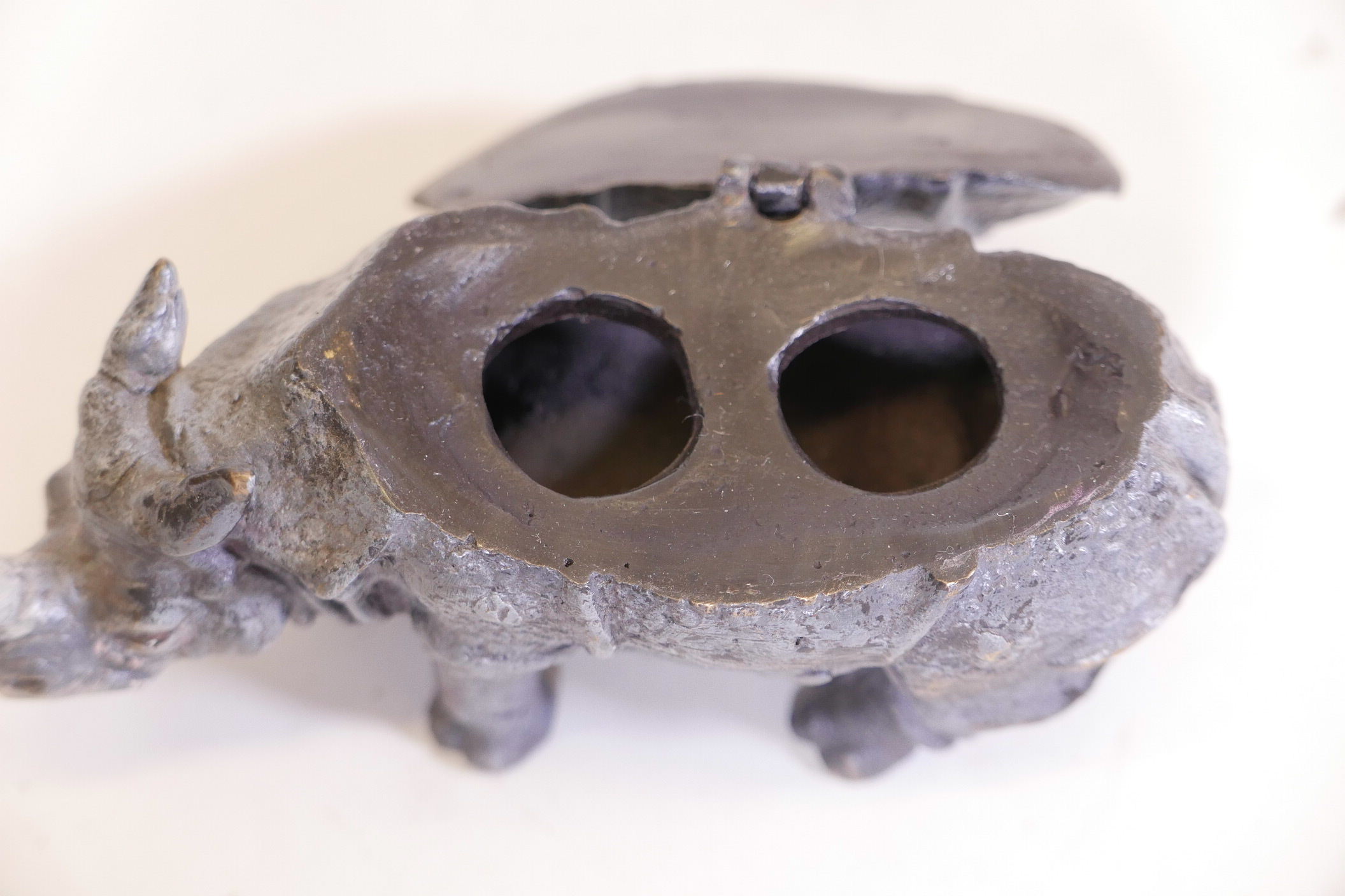 A cold painted bronze inkwell in the form of a rhinoceros, fitted with two wells, lacking liners, - Image 3 of 3