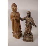 A carved wood figurine of Jesus, 13" high, and a carved wood figurine of Buddha standing in
