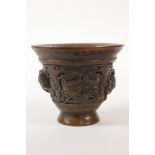 A Chinese faux horn libation cup with carved kylin decoration, 4 character mark to base, 3" high