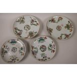 A pair of C19th Chinese porcelain plates decorated with vases of flowers, 8" diameter, together with