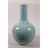 A Chinese light blue glazed porcelain bottle vase, 6 character mark to base, 12" high