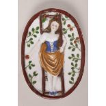 A Continental porcelain pin tray moulded as a young girl picking apples, her skirt caught on the