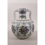 A Chinese doucai porcelain two handled garlic head flask with floral decoration, 6 character mark to