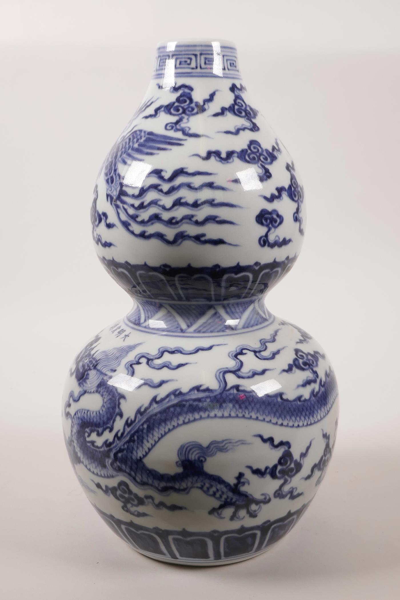 A Chinese double gourd pottery vase decorated with a dragon and phoenix in flight, 6 character - Image 2 of 6