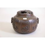 A C19th Japanese bronze censer with pierced cover, the body with panels and raised decoration, A/F