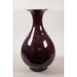 A large Chinese flambé glazed pear shaped vase with flared rim, 14" high