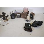 A quantity of vintage meters, a Limit fan, spotlight, camera lenses, an early Panasonic mobile