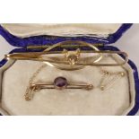A 9ct gold and amethyst pin brooch and a 9ct gold fox head tie pin, gross 5.4 grams