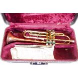 A Conn of USA bandsman's trumpet in case, lacks mouthpiece, 18½" long