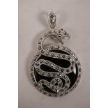 A large silver, marcasite and onyx pendant with snake decoration, 2½"