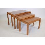 A Gordon Russell teak nest of tables, plaque to underside, largest 27"x18"x18" high