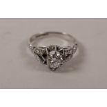 An 18ct white gold brilliant cut diamond set engagement ring, approximate size 'N'