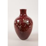 A Chinese porcelain vase with a red and green splatter glaze, 6 character mark to base, 6½" high