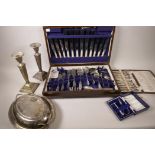 A canteen of silver plated cutlery, together with a box of silver plated coffee spoons and tongs,